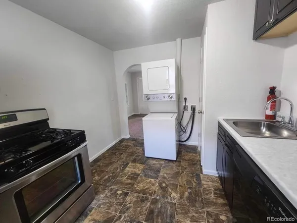 a kitchen with a stove and a sink