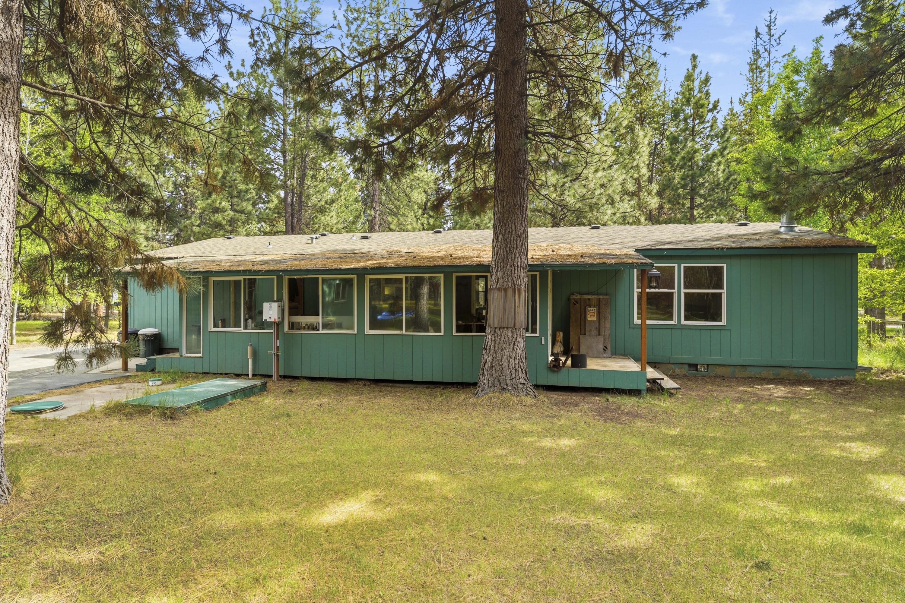 16928 Covina Road Bend, OR 97707 - Photo 36 of 48 a view of a house with a swimming pool