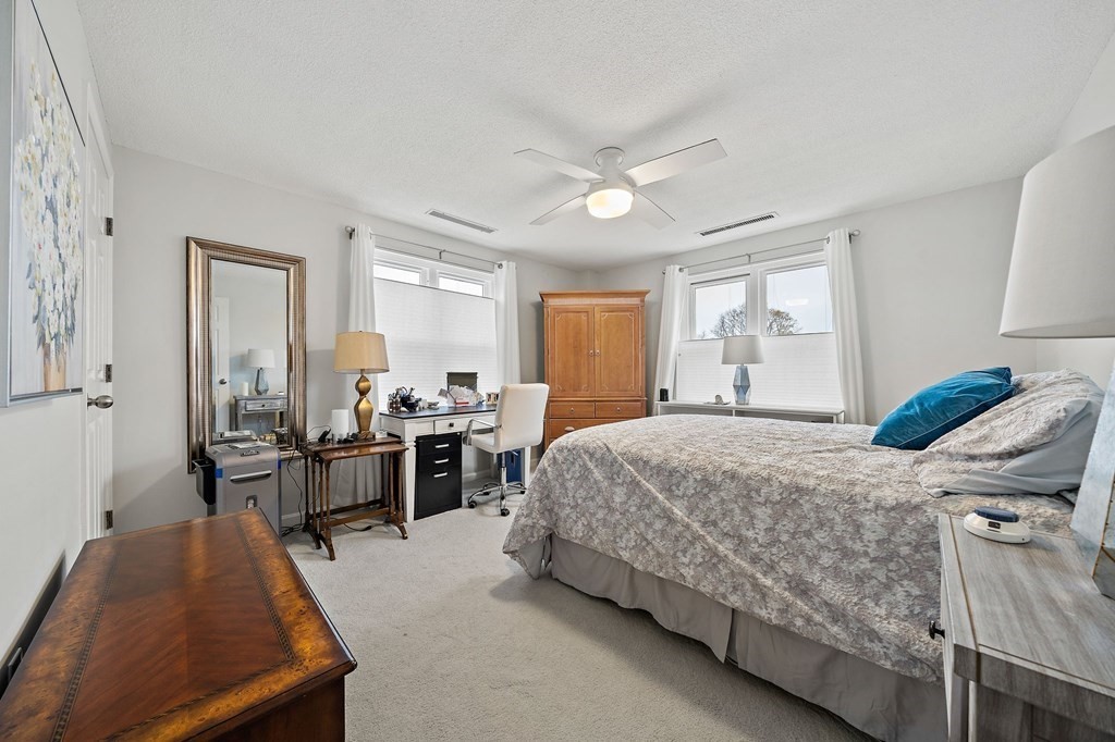 20 Rockland House Road, Unit 406 Hull, MA 02045 - Photo 18 of 39 a bedroom with a bed and a large window