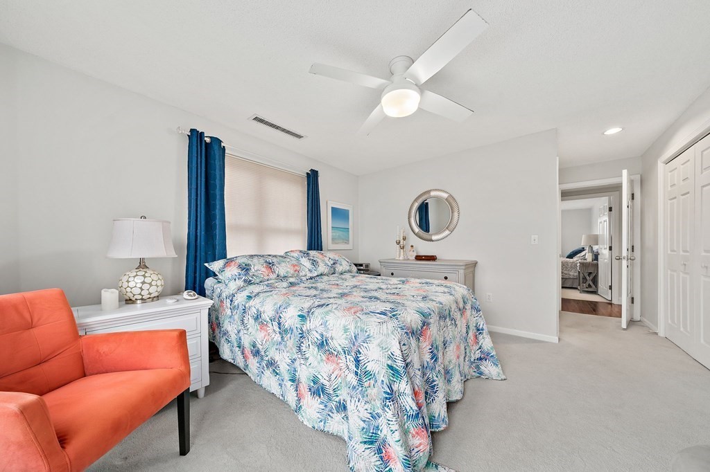 20 Rockland House Road, Unit 406 Hull, MA 02045 - Photo 23 of 39 a bedroom with bed and a couch