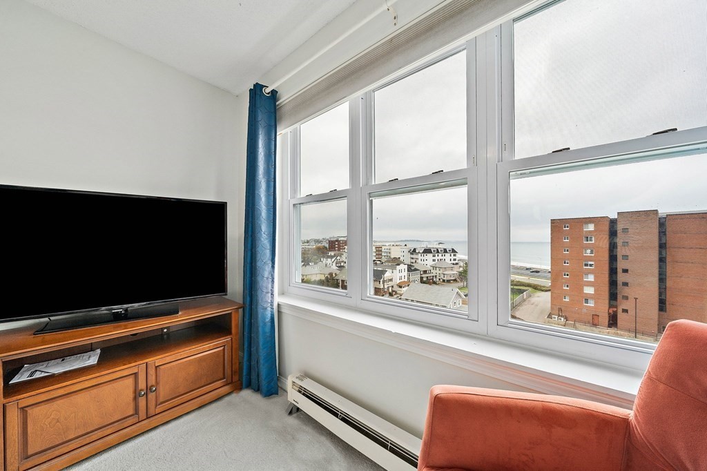 20 Rockland House Road, Unit 406 Hull, MA 02045 - Photo 25 of 39 a living room with flat screen tv and a window