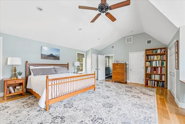 a bedroom with furniture and a window