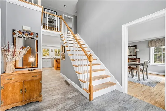 a view of a hallway with furniture and staircase
