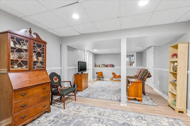 a living room with furniture a rug and appliances