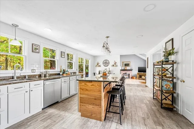 a large kitchen with lots of counter space a sink and appliances