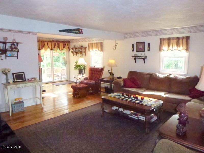 148 Mohawk Trail Florida, MA 01247 - Photo 11 of 18 a living room with furniture and a large window