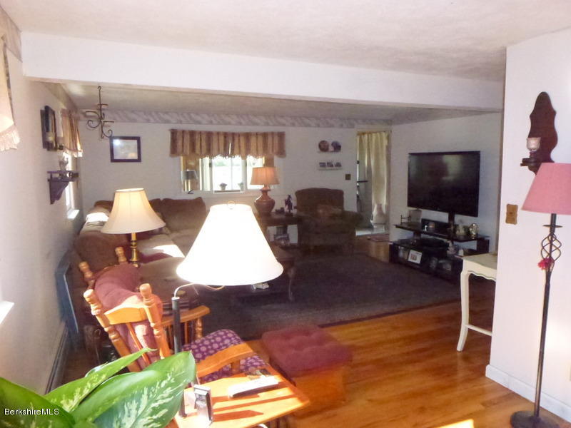 148 Mohawk Trail Florida, MA 01247 - Photo 12 of 18 a living room with furniture and a flat screen tv