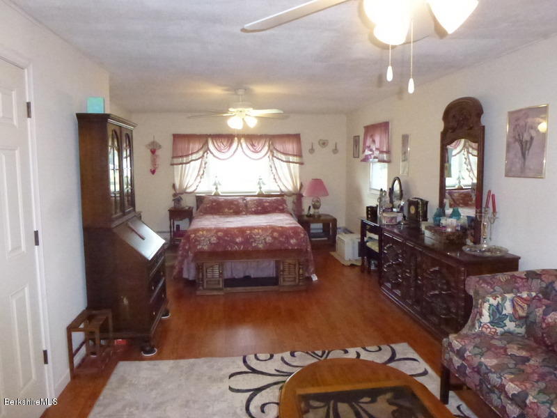 148 Mohawk Trail Florida, MA 01247 - Photo 15 of 18 a bedroom with furniture and a wooden floor