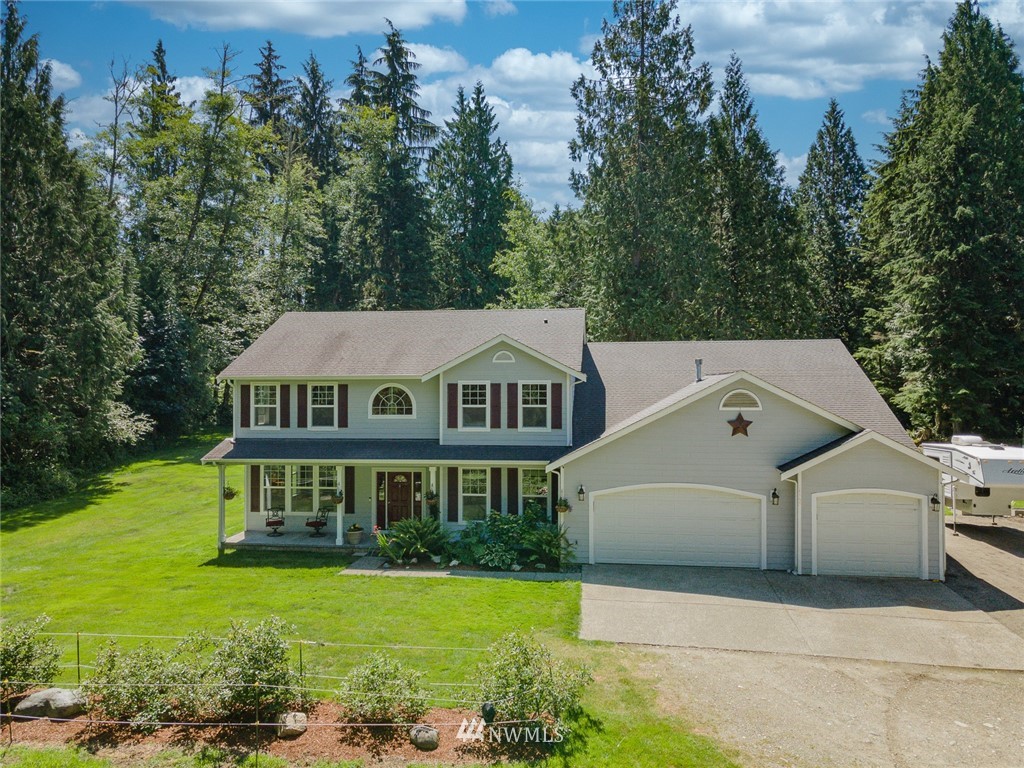16108 OK Mill Road Snohomish, WA 98290 - Photo 1 of 23 a front view of a house with garden