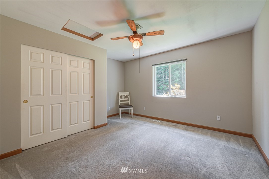 16108 OK Mill Road Snohomish, WA 98290 - Photo 16 of 23 an empty room with windows and fan