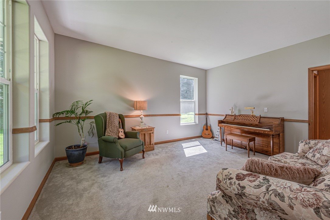 16108 OK Mill Road Snohomish, WA 98290 - Photo 5 of 23 a living room with furniture and a piano
