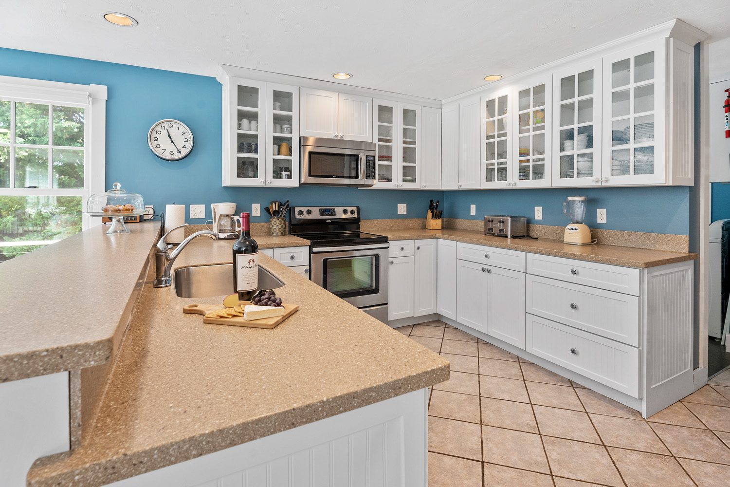 5 Katama Drive Edgartown, MA 02539 - Photo 5 of 28 a kitchen with stainless steel appliances granite countertop a sink stove and cabinets