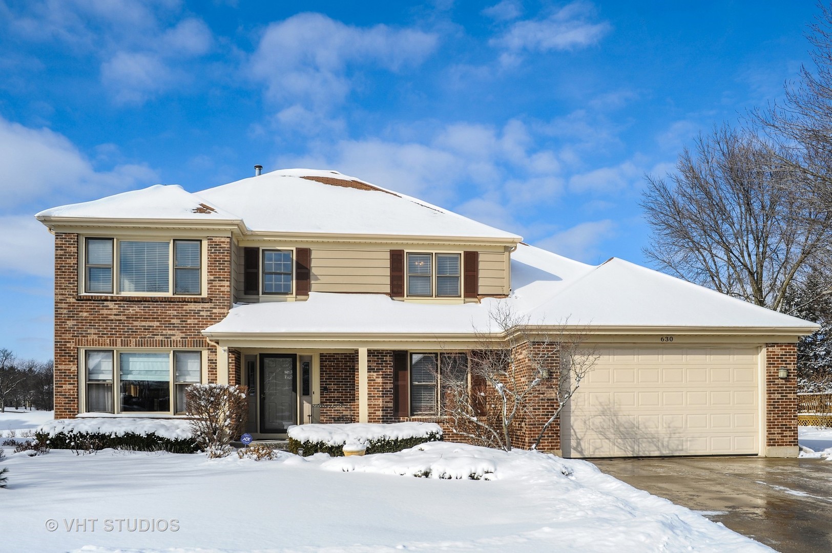 630 Raintree Road Buffalo Grove, IL 60089 - Photo 1 of 26 a front view of a house with yard