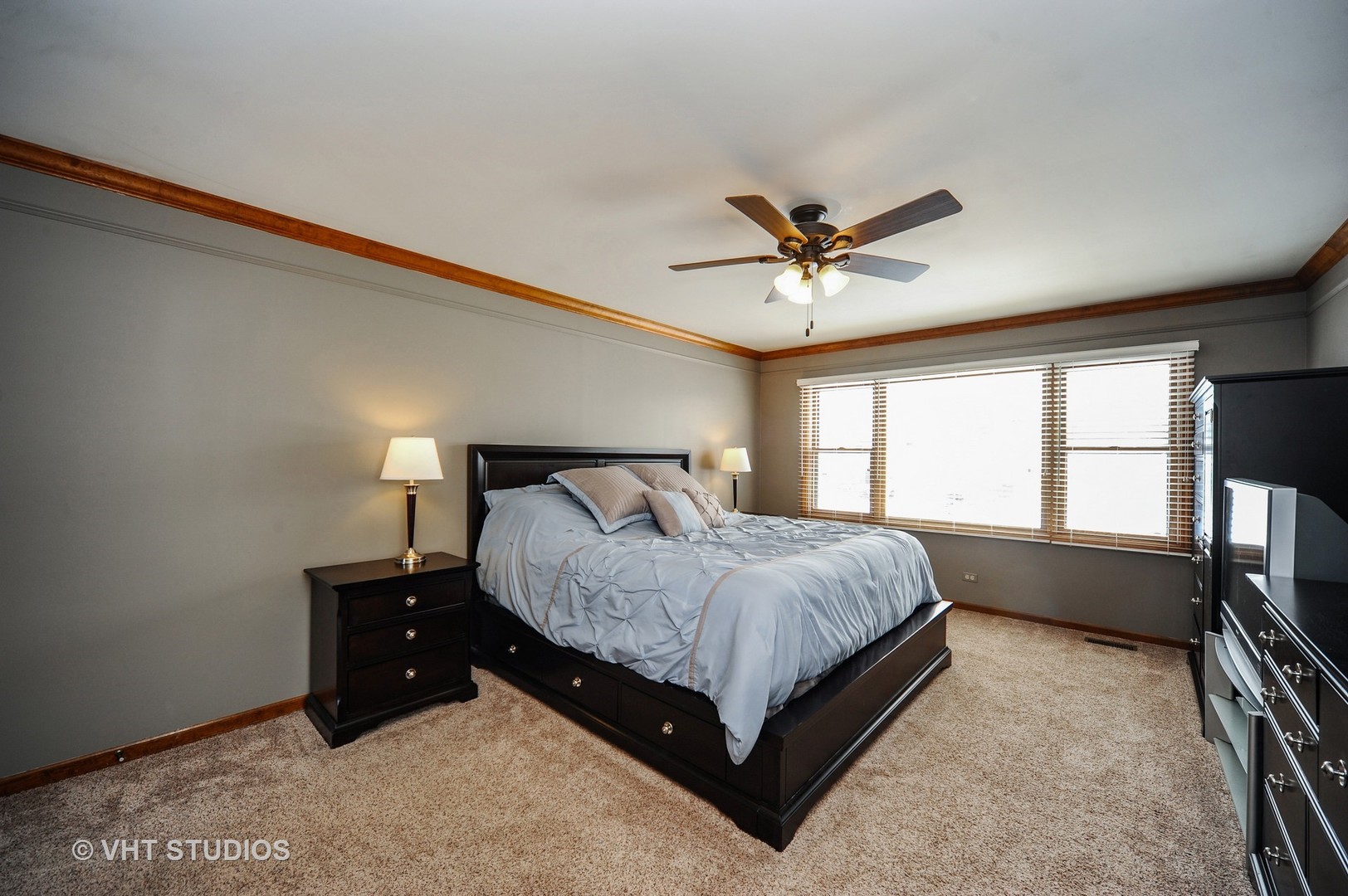 630 Raintree Road Buffalo Grove, IL 60089 - Photo 11 of 26 a spacious bedroom with a bed and window