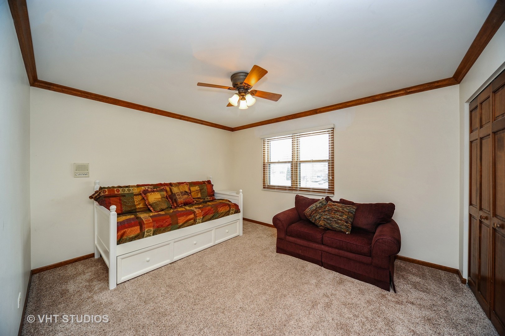 630 Raintree Road Buffalo Grove, IL 60089 - Photo 14 of 26 a living room with furniture ceiling fan and a window