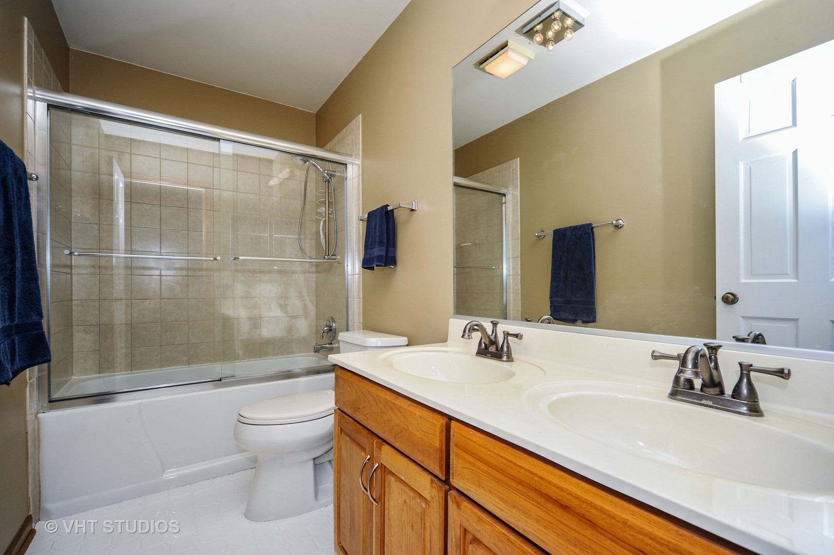 630 Raintree Road Buffalo Grove, IL 60089 - Photo 18 of 26 a bathroom with a sink a toilet and shower
