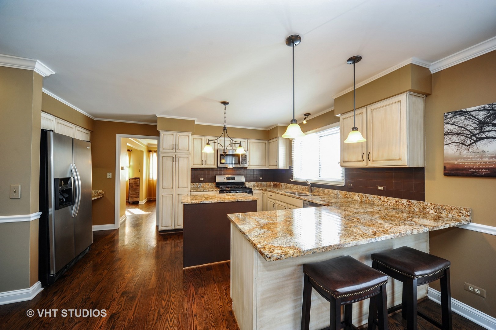 630 Raintree Road Buffalo Grove, IL 60089 - Photo 3 of 26 a kitchen with stainless steel appliances granite countertop a sink a stove and refrigerator