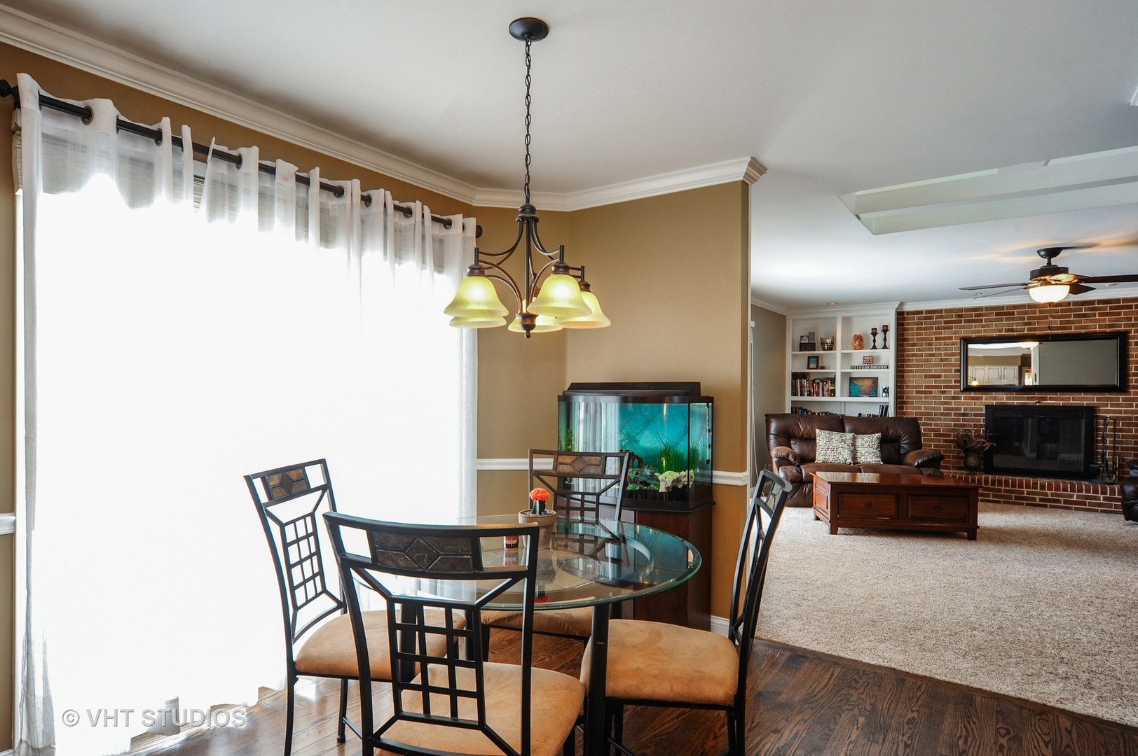 630 Raintree Road Buffalo Grove, IL 60089 - Photo 6 of 26 a dining room with furniture a chandelier and window