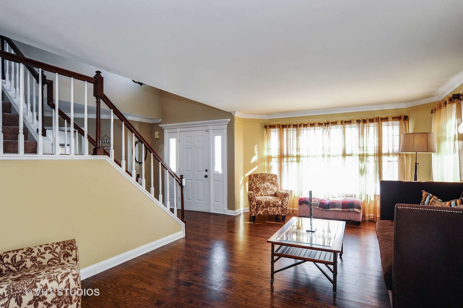 630 Raintree Road Buffalo Grove, IL 60089 - Photo 9 of 26 a living room with furniture and floor to ceiling windows
