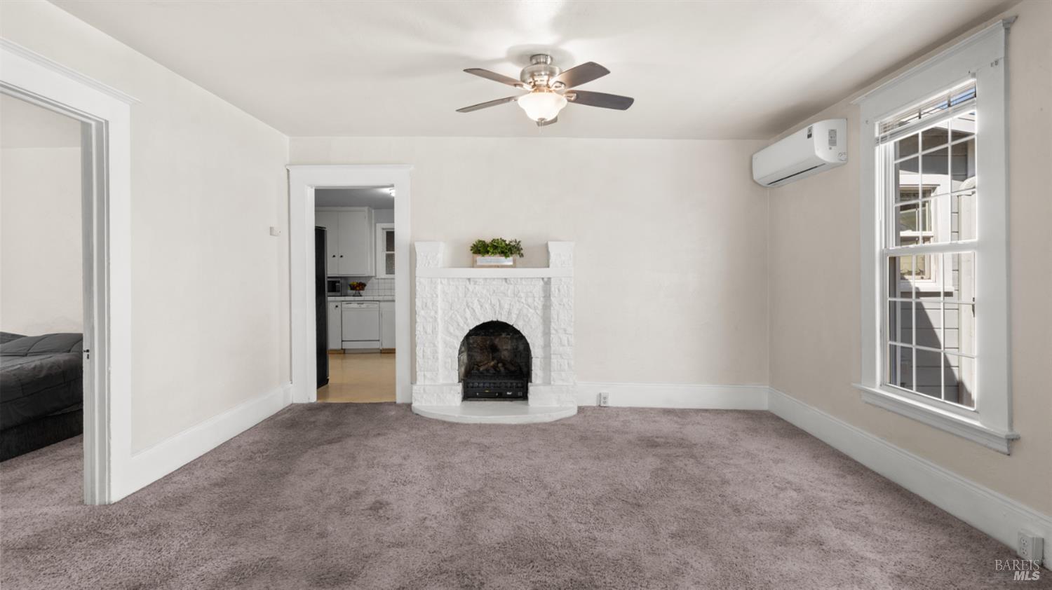 125 Kendal Street Vacaville, CA 95688 - Photo 15 of 45 a view of a livingroom with a fireplace a chandelier and closet