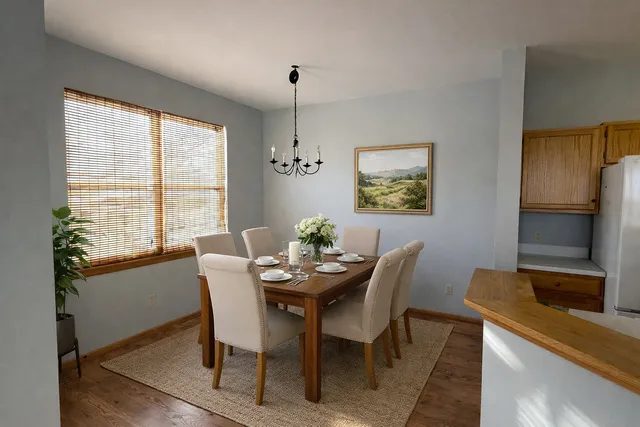 a dining room with furniture and window