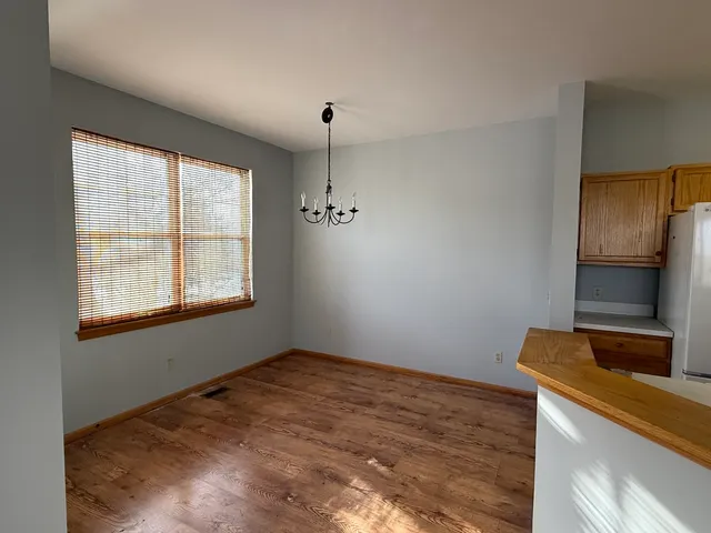 a room with a bed and a window