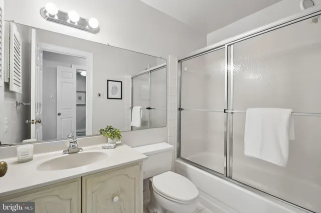 a bed room with a bed and a large window