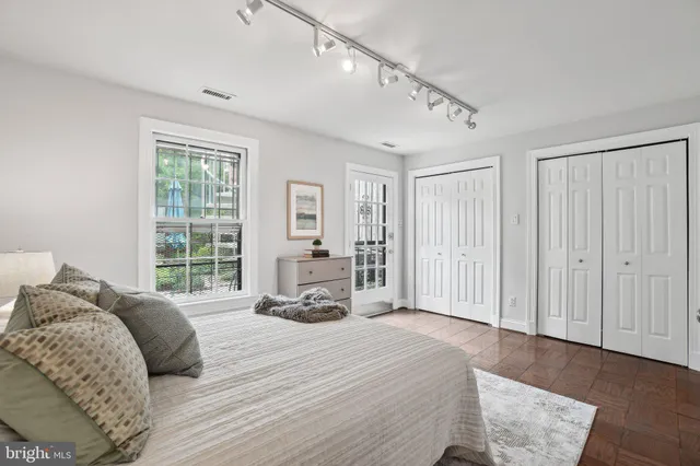 a bed room with a bed and a window