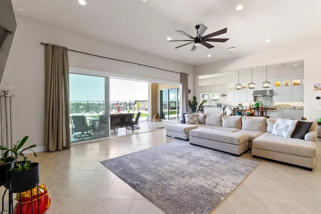 a living room with furniture and a next to a window