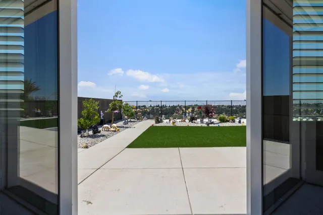 a bedroom with a bed and painting on the wall