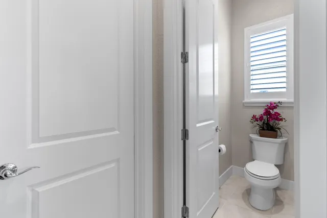 a bathroom with a sink a toilet a shower and a mirror