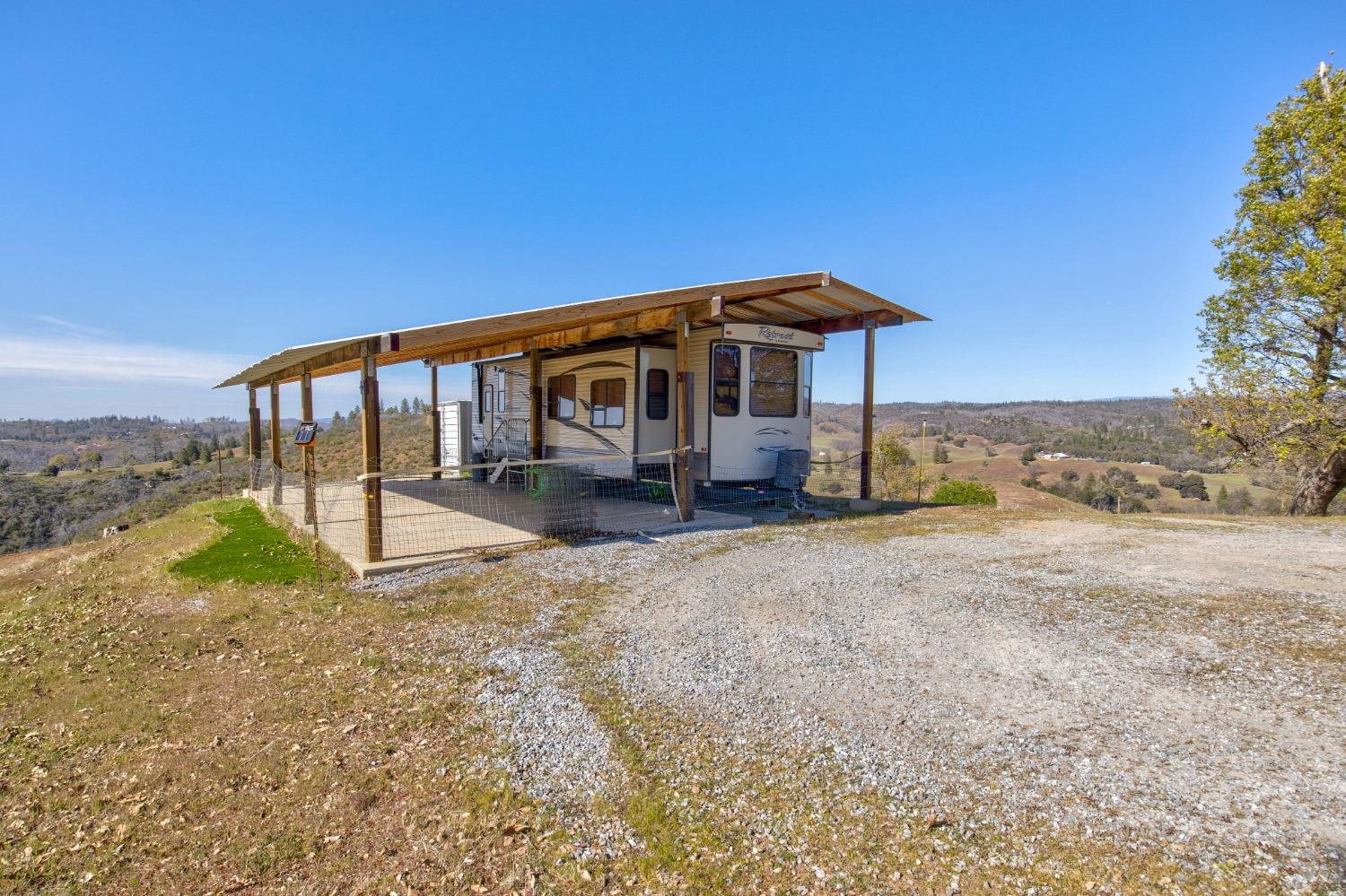 7005 Mountain Ranch Road Mountain Ranch, CA 95246 - Photo 48 of 90 a view of a house with backyard and roof