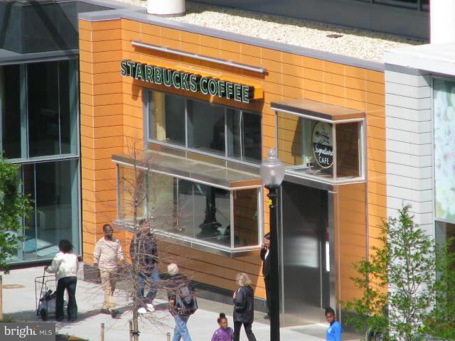 490 M Street Southwest, Unit W609 Washington, DC 20024 - Photo 11 of 19 a front view of a building with outdoor seating
