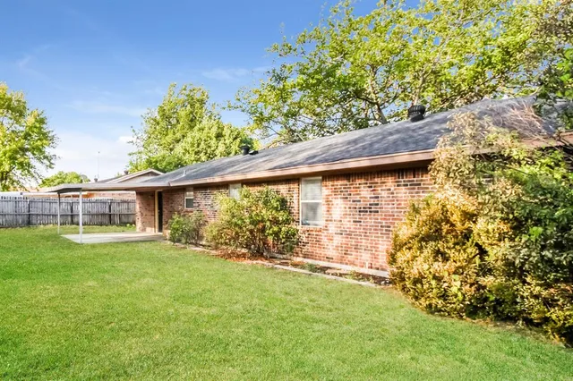 a view of a backyard with a garden