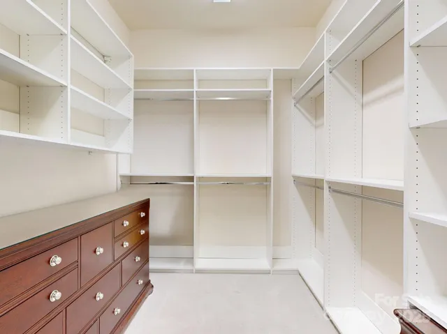 a kitchen with cabinets and window