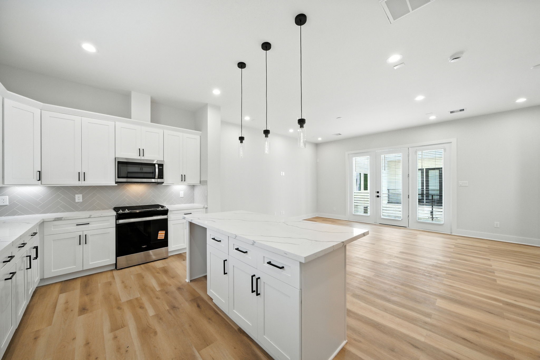 2304 Hoskins Drive, Unit D Houston, TX 77080 - Photo 19 of 41 a large kitchen with stainless steel appliances granite countertop a stove and a sink