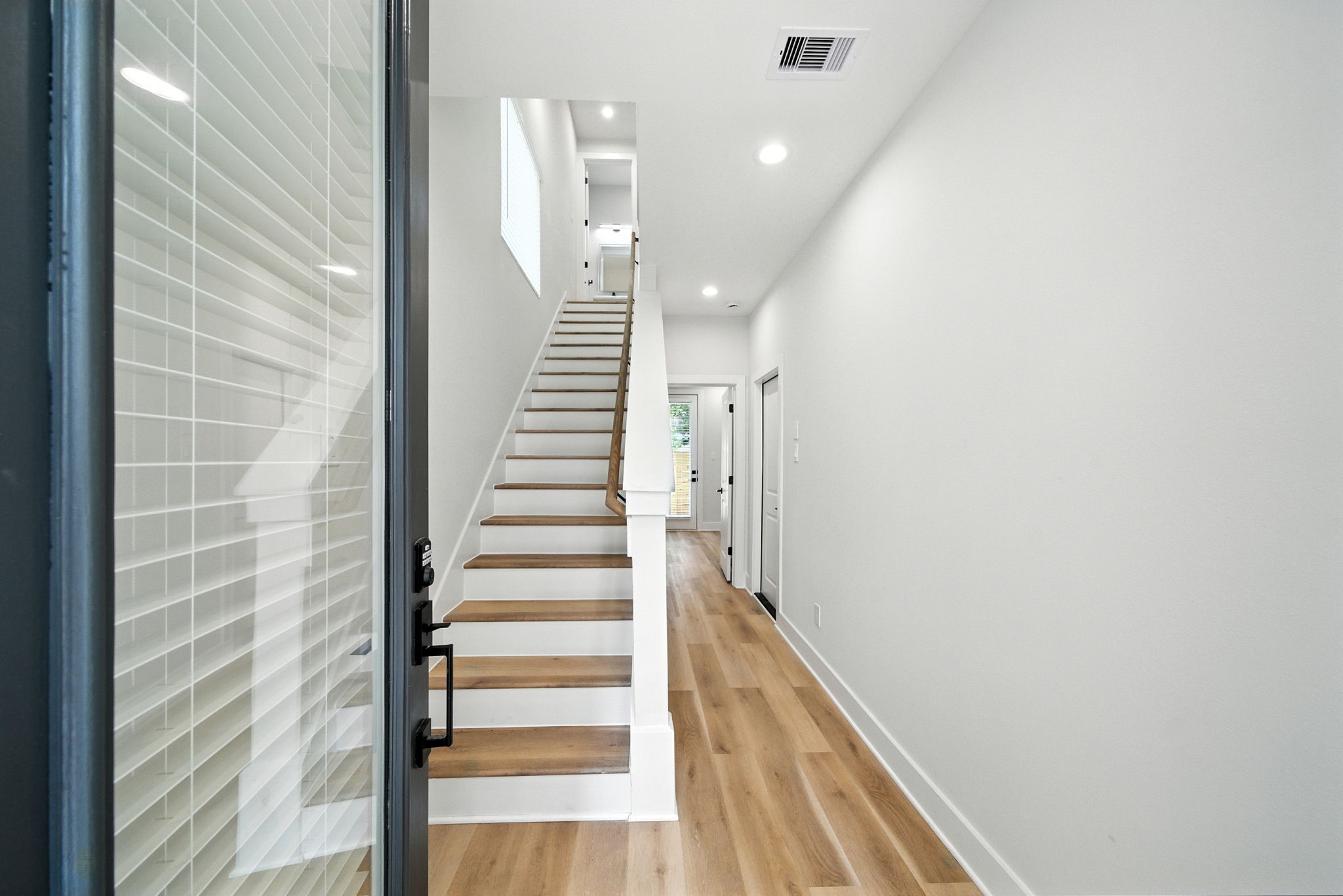 2304 Hoskins Drive, Unit D Houston, TX 77080 - Photo 2 of 41 a view of entryway with wooden floor