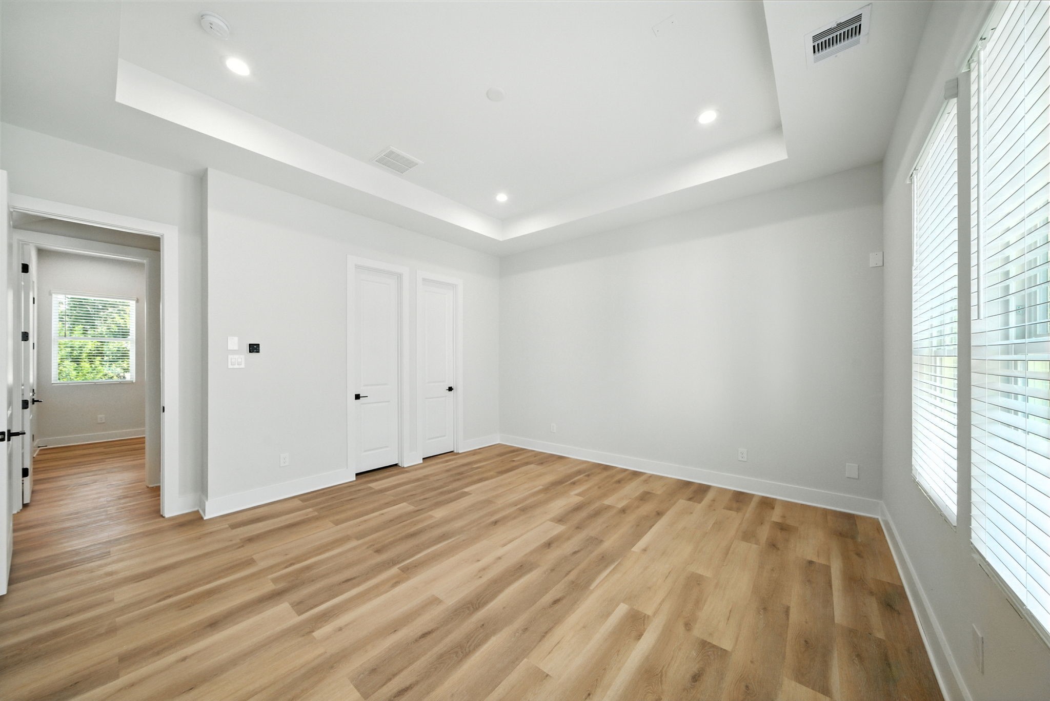 2304 Hoskins Drive, Unit D Houston, TX 77080 - Photo 29 of 41 an empty room with wooden floor and windows