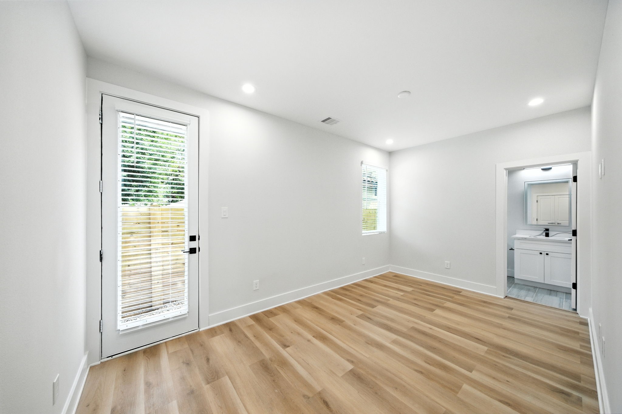 2304 Hoskins Drive, Unit D Houston, TX 77080 - Photo 4 of 41 a view of empty room with wooden floor