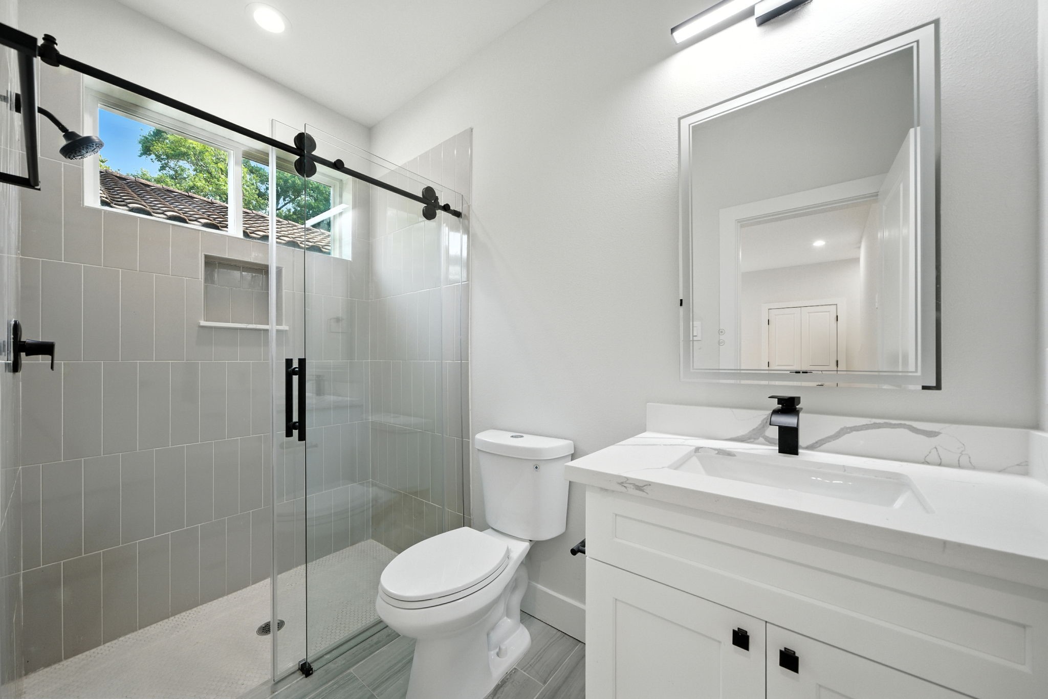 2304 Hoskins Drive, Unit D Houston, TX 77080 - Photo 6 of 41 a bathroom with a sink a toilet and shower