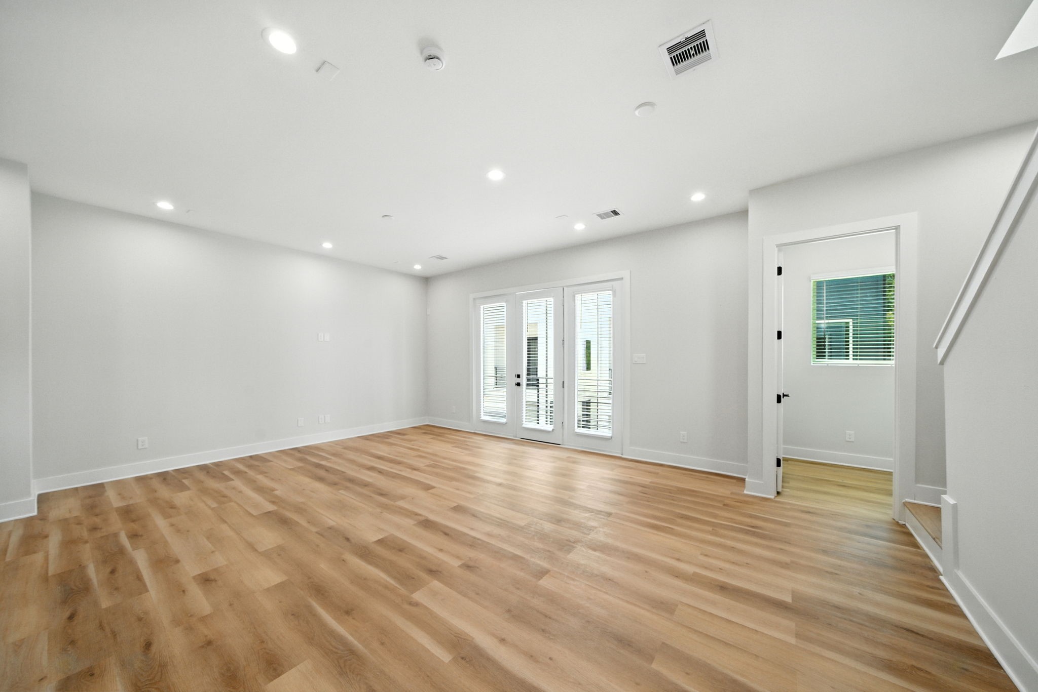 2304 Hoskins Drive, Unit D Houston, TX 77080 - Photo 10 of 41 a view of an empty room with wooden floor
