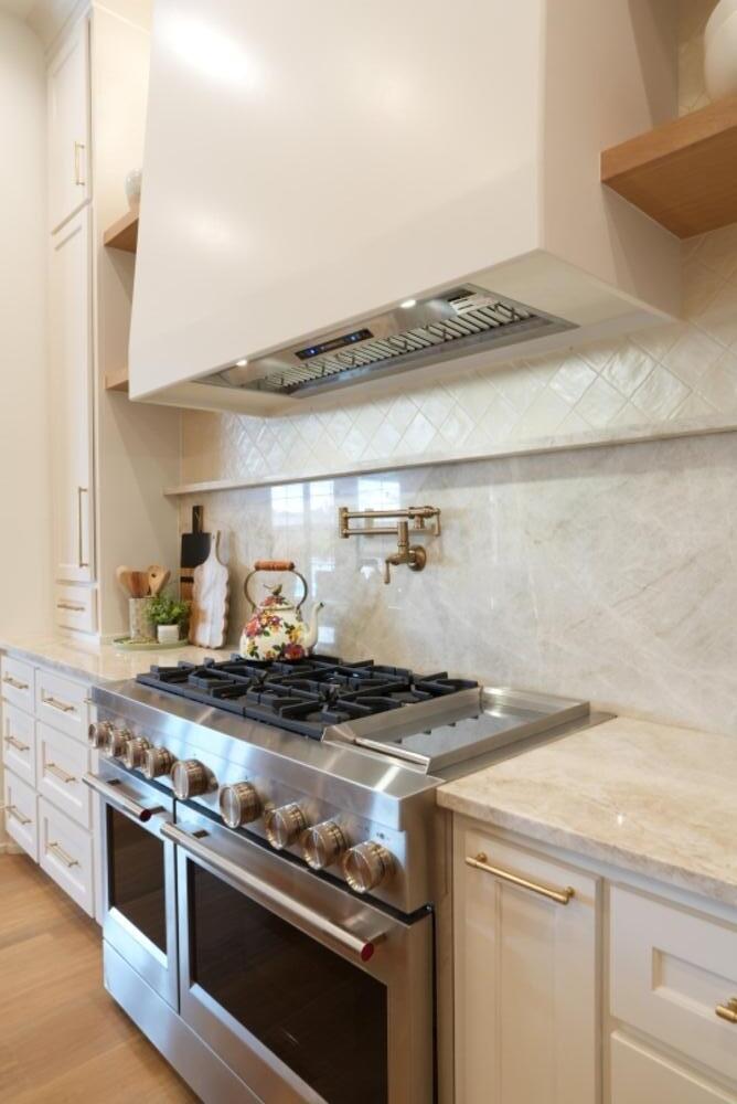 4101 149th Street Lubbock, TX 79423 - Photo 24 of 53 a stove top oven sitting inside of a kitchen