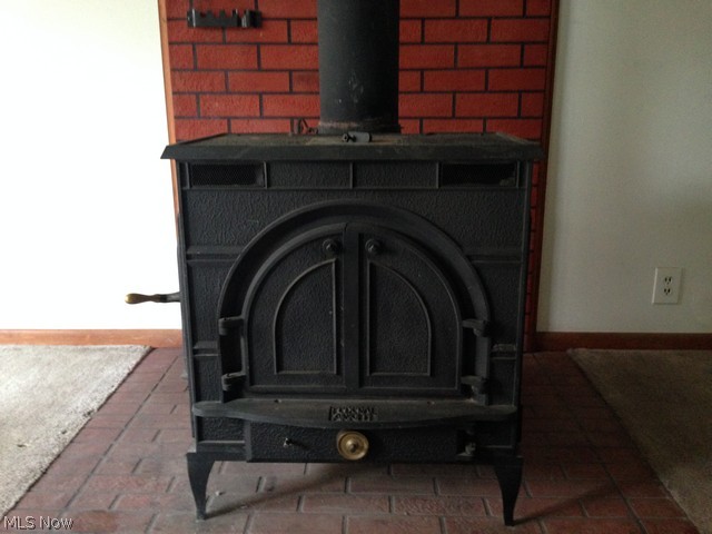 1755 Lafevre Road Geneva, OH 44041 - Photo 11 of 17 Wood burner in living room