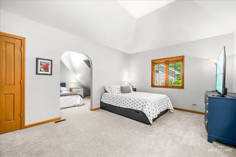 a bedroom with bed and window