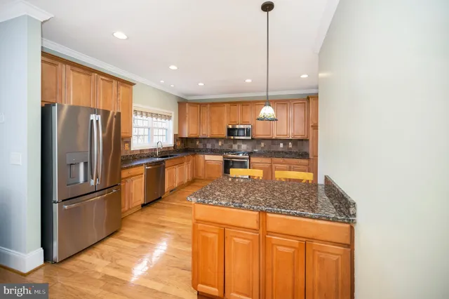 a view of empty room with fireplace and fan