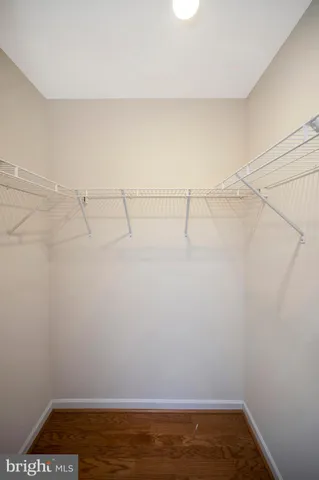 a kitchen with stainless steel appliances granite countertop furniture a refrigerator and a sink