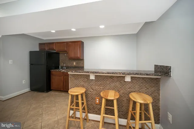 a bathroom with a toilet sink and a mirror