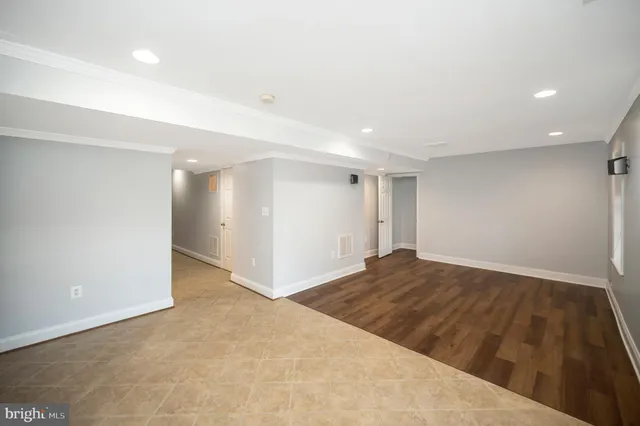 a view of balcony with wooden floor and fence