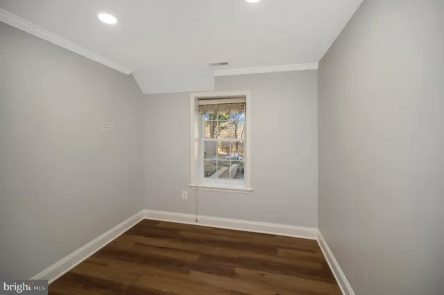 a view of a house with a yard and deck