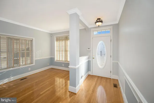 a view of entryway with wooden floor